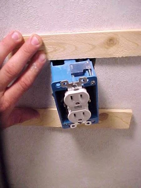 how to straighten a twisted electrical outlet box|fix crooked outlet box.